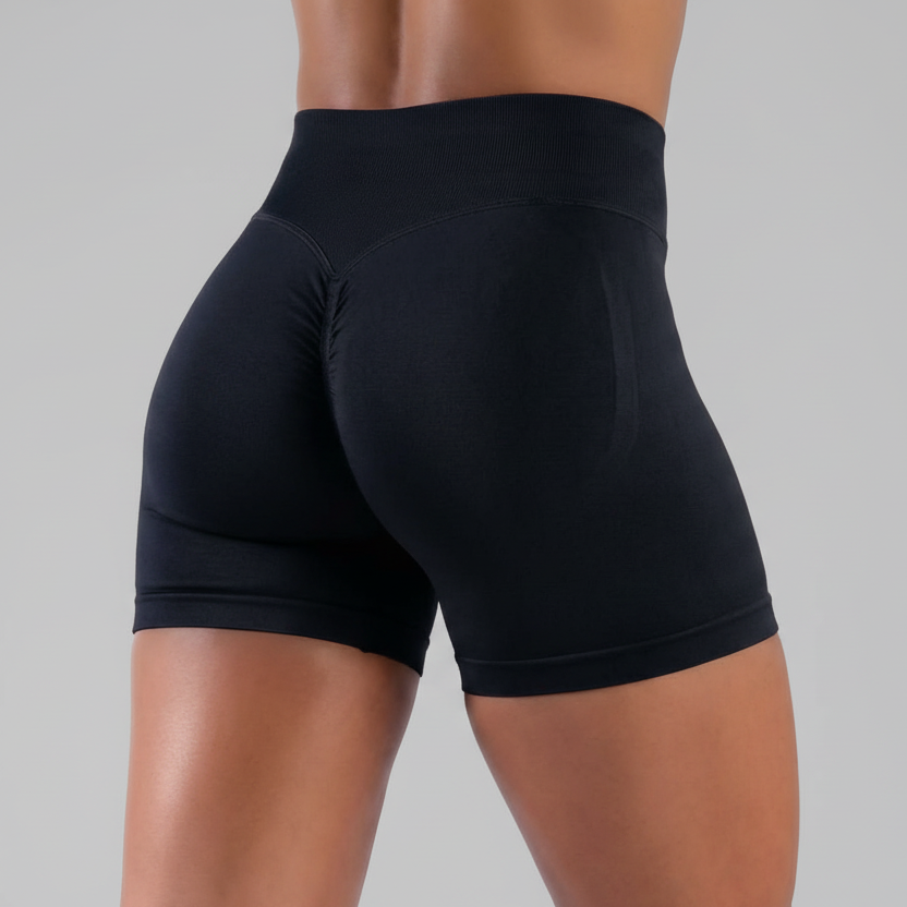 Black athletic FormFlex™ Ribbed shorts worn by a person on a white background