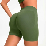 Green SOFTFORM™ Seamless Shorts worn by a person on a white background