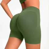 Green SOFTFORM™ Seamless Shorts worn by a person on a white background
