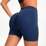 Navy blue SOFTFORM™ Seamless Shorts worn by a person on a light gray background