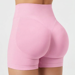 Light Pink high-waisted shorts on a plain background