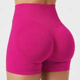 Pink SoftForm™ High-Rise Shorts on a plain background