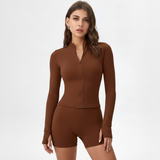 Woman wearing a brown SoftForm™ Long-Sleeve Topand shorts on a white background