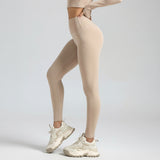 Beige SoftForm_Sculpt leggings worn by a person on a light gray background