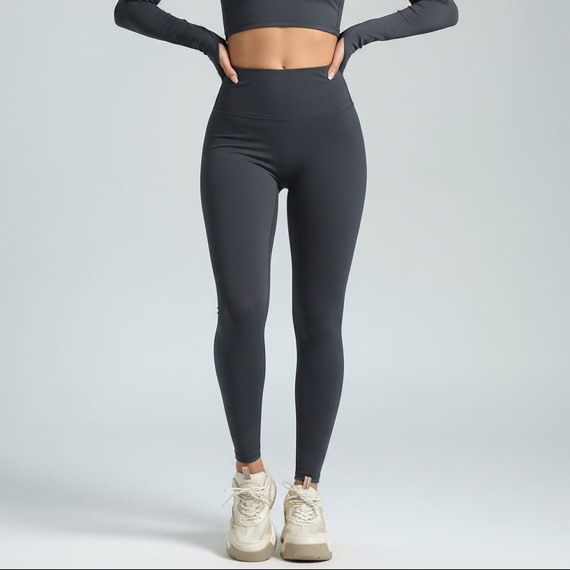 Person wearing stone SoftForm Sculpt_Leggings leggings and a cropped top on a plain background