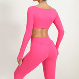 Woman wearing a SoftForm™ Sculpt Tank bright pink athletic outfit on a white background