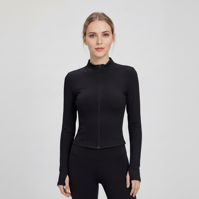 Woman wearing a SoftForm™ Slim Jacket black  athletic top on a light gray background