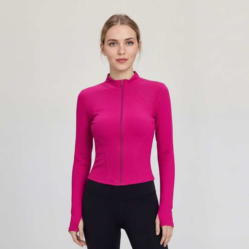 Woman wearing a bright pink SoftForm™ Slim Jacket on a light gray background